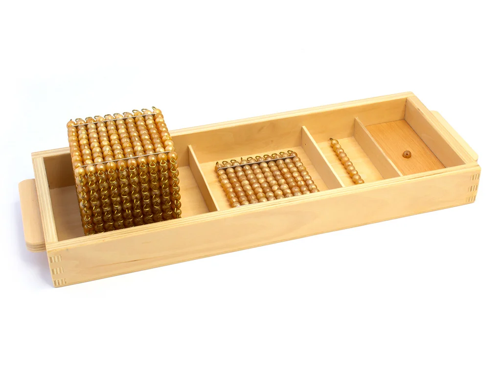 The Decimal System introduced as quantity, with golden bead material on trays