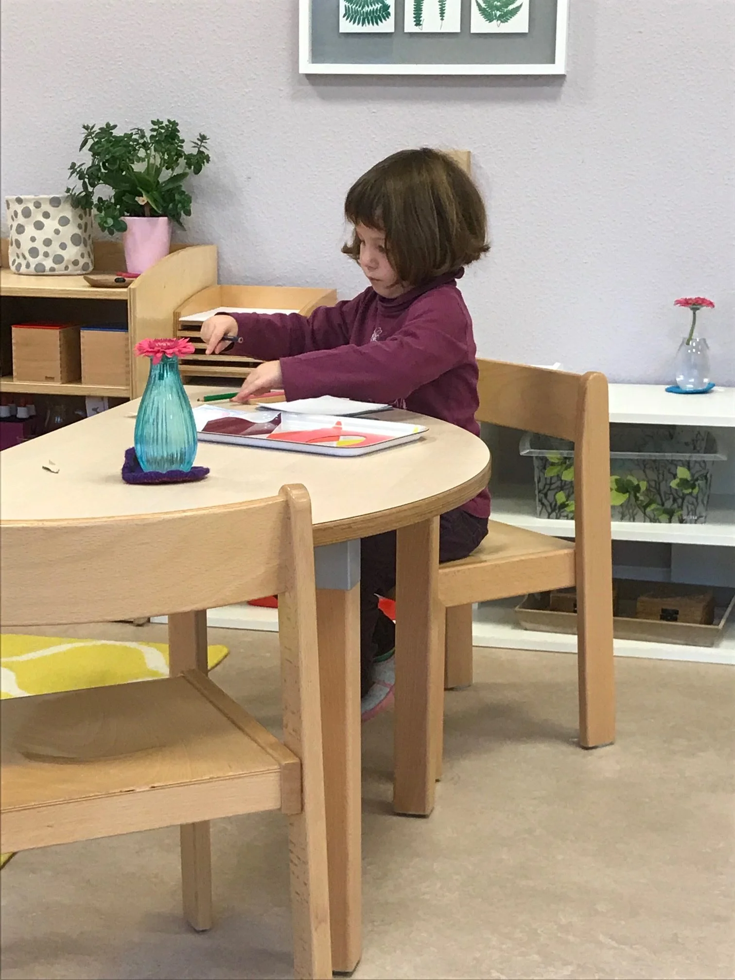 A Child working with the Metal Insets